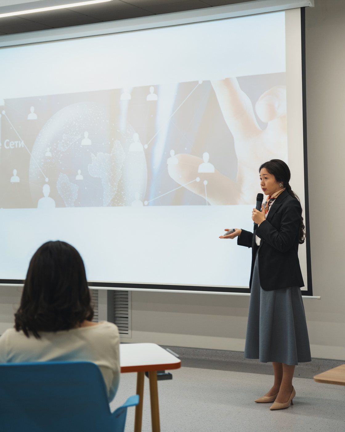 A mentor speaking to a small group of students